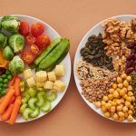 A vibrant flatlay of colorful vegetables and nuts showcasing a balanced diet concept.