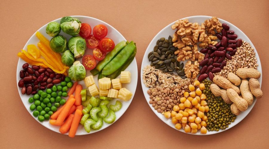 A vibrant flatlay of colorful vegetables and nuts showcasing a balanced diet concept.