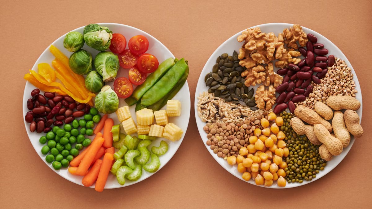 A vibrant flatlay of colorful vegetables and nuts showcasing a balanced diet concept.